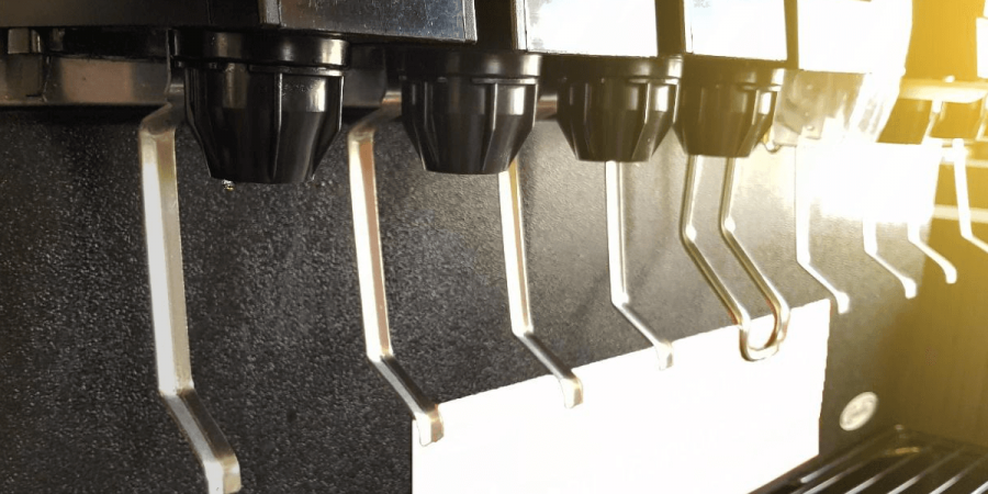 Close up image of a restaurant soda machine